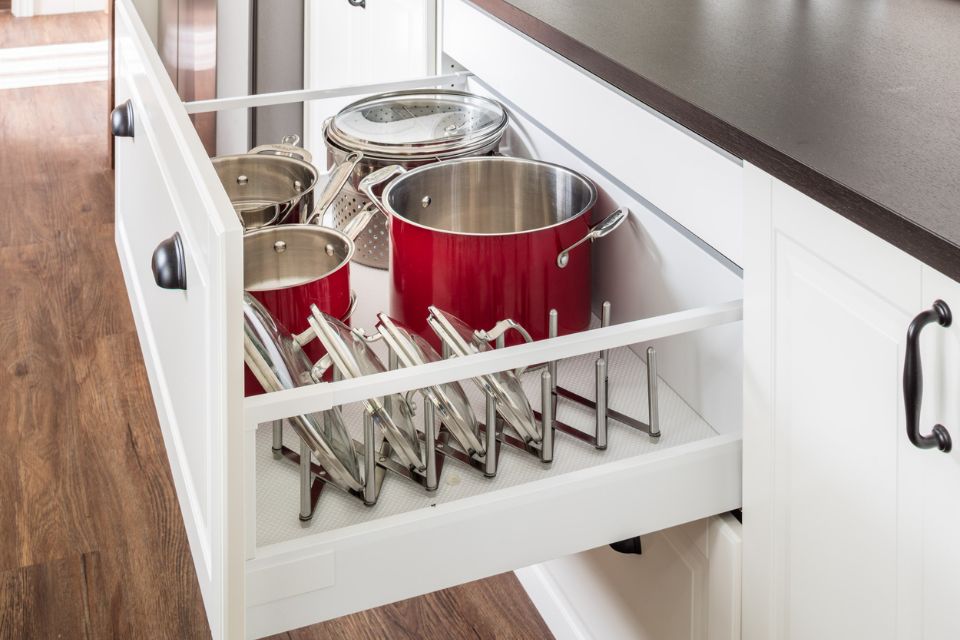 kitchen drawer open showing pot and pan organizer 
